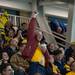A fan raises up puck after one was hit out of the rink during the third period.
Courtney Sacco I AnnArbor.com   